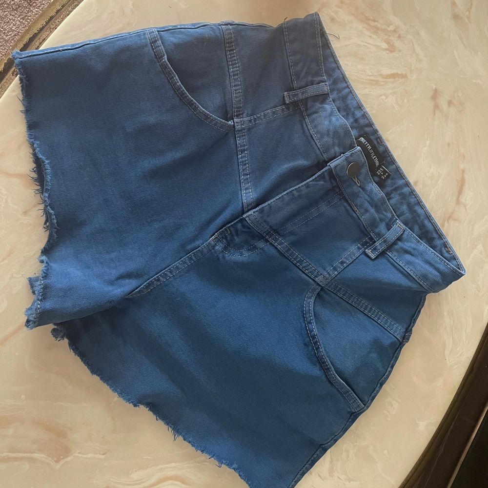 PrettyLittleThing denim shorts.